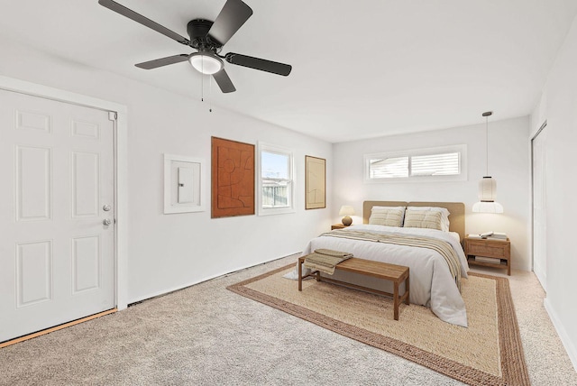 carpeted bedroom with ceiling fan