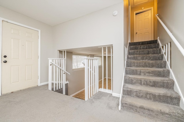 stairs with carpet flooring and baseboards