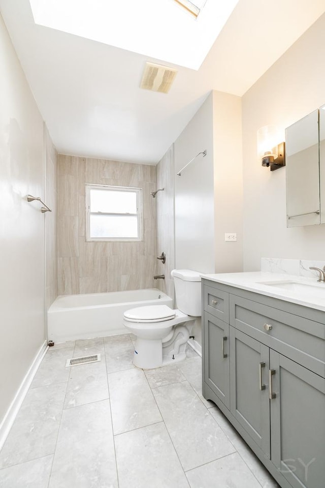 full bathroom featuring toilet, vanity, visible vents, baseboards, and shower / washtub combination