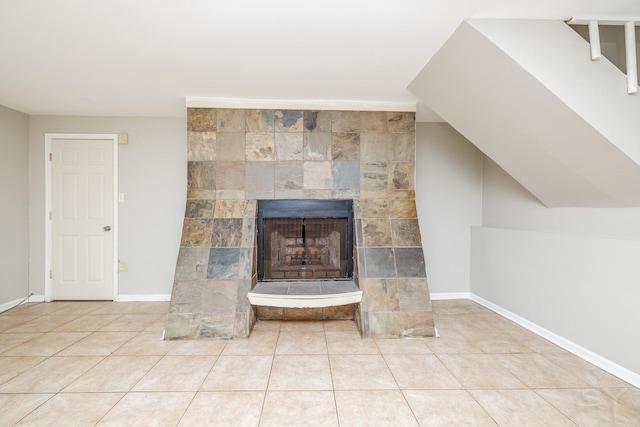 room details featuring a fireplace and baseboards