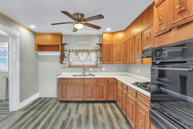 kitchen with brown cabinetry, a sink, gas cooktop, and open shelves