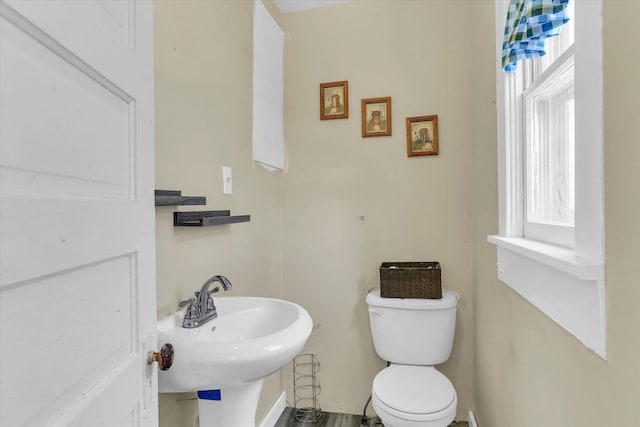 bathroom featuring toilet and a sink