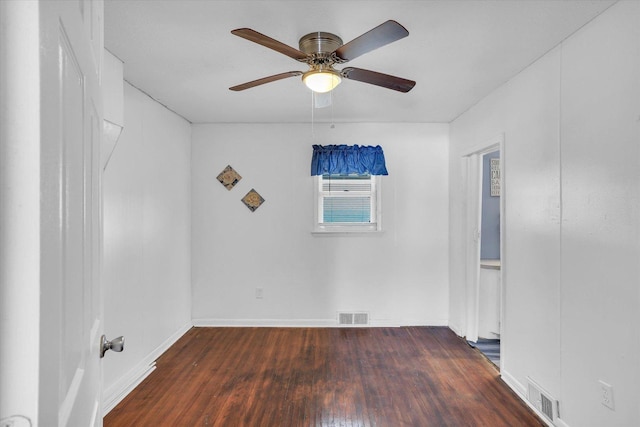 unfurnished room featuring wood finished floors, visible vents, and a ceiling fan