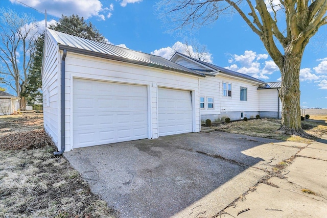 garage featuring driveway