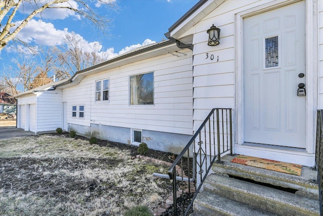 property entrance with a garage