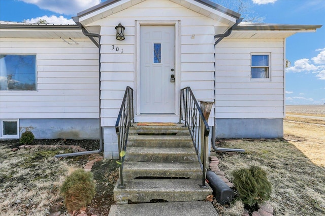 property entrance with metal roof