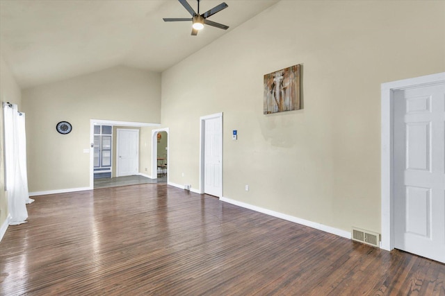 unfurnished living room with baseboards, ceiling fan, visible vents, and wood finished floors