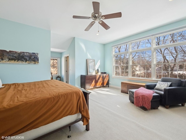 carpeted bedroom with a ceiling fan