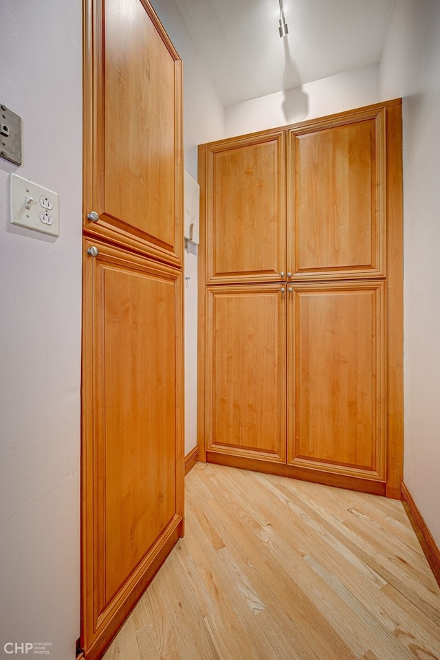 interior details featuring baseboards and wood finished floors