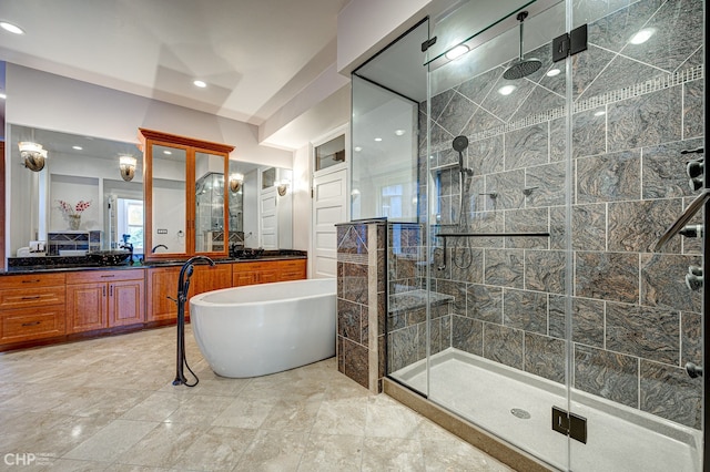 bathroom featuring a freestanding tub, a shower stall, and vanity