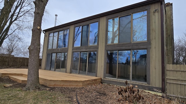 back of house featuring fence