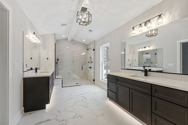 bathroom featuring marble finish floor, a sink, and a marble finish shower