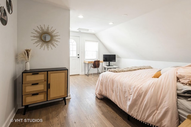 bedroom with baseboards, vaulted ceiling, dark wood-style flooring, and recessed lighting