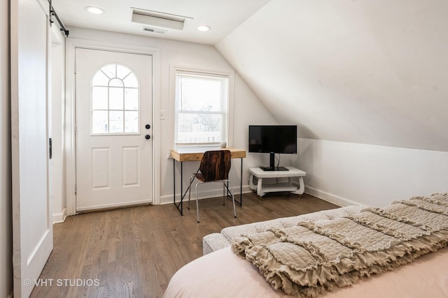 entrance foyer with vaulted ceiling, dark wood-type flooring, and baseboards