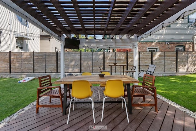 wooden deck featuring outdoor dining area, fence, a lawn, and a pergola