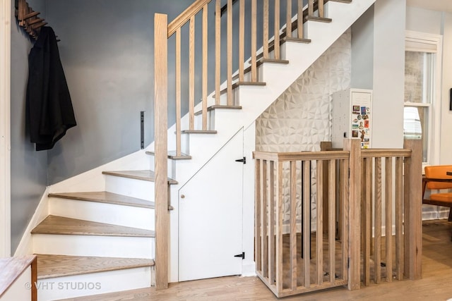 stairway featuring wood finished floors