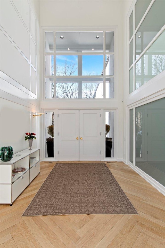 entryway with a towering ceiling