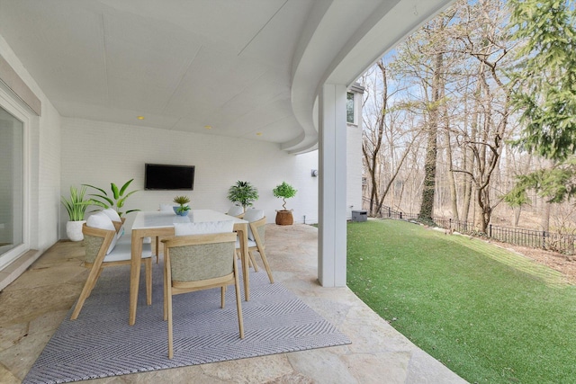 view of patio / terrace with outdoor dining space and fence