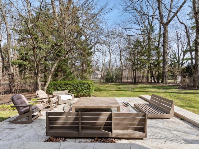 view of patio featuring an outdoor hangout area and fence