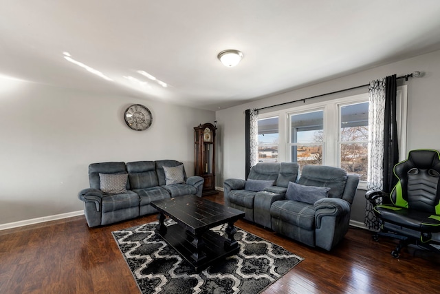 living room with baseboards and wood finished floors