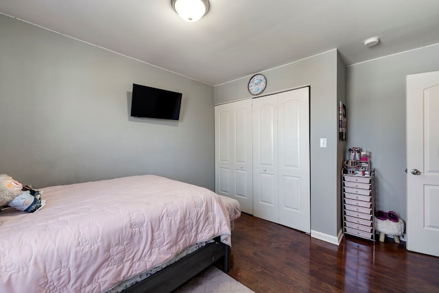 bedroom with a closet and wood finished floors