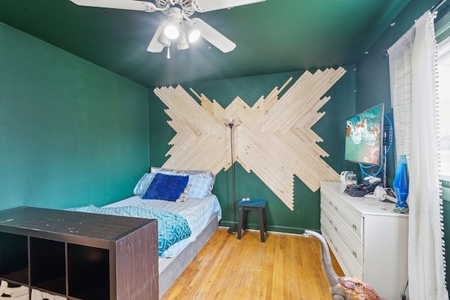 bedroom featuring ceiling fan and wood finished floors