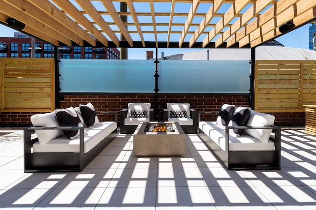 view of patio / terrace featuring an outdoor living space with a fire pit and a pergola