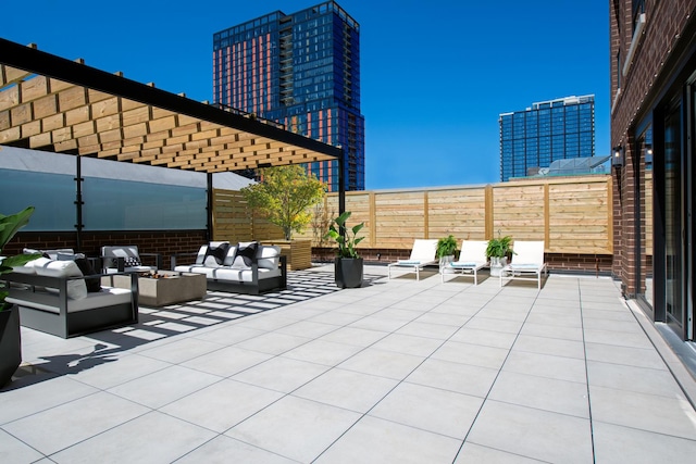 view of patio featuring outdoor lounge area and fence