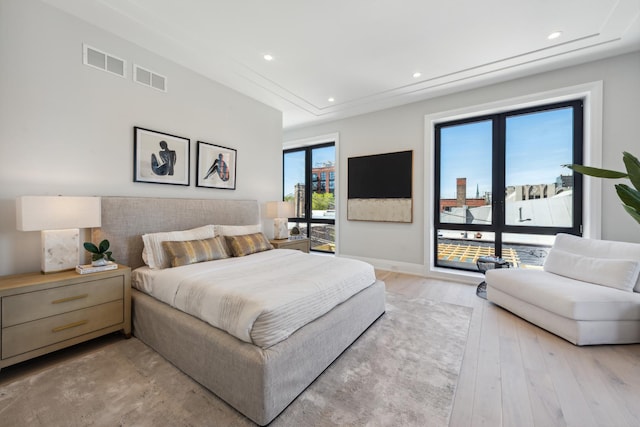 bedroom with recessed lighting, access to outside, baseboards, and light wood finished floors