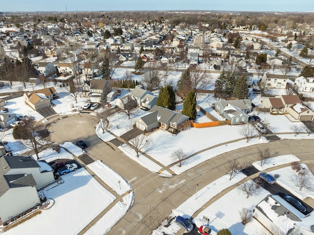 snowy aerial view featuring a residential view