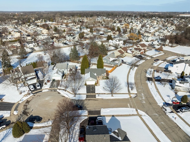 snowy aerial view featuring a residential view