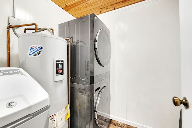 laundry area with laundry area, wooden ceiling, stacked washer and clothes dryer, and electric water heater