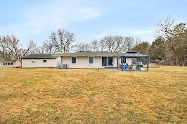 rear view of property with a yard, cooling unit, a patio, and a gazebo