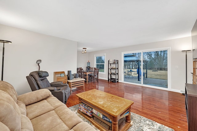 living room featuring wood finished floors and baseboards