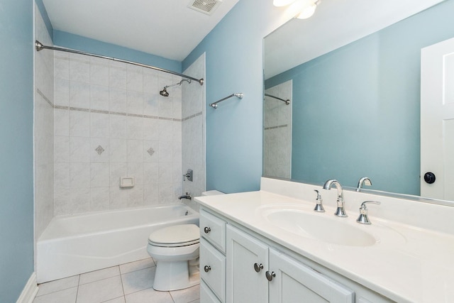 bathroom featuring visible vents, toilet, tub / shower combination, vanity, and tile patterned floors