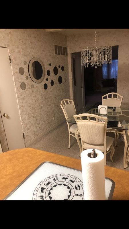 dining space featuring visible vents and a notable chandelier