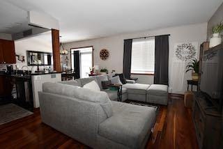 living room featuring dark wood-type flooring