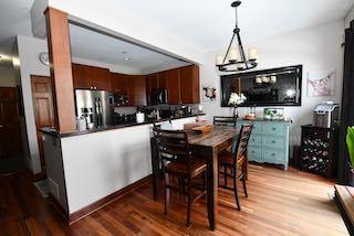 dining room featuring an inviting chandelier and wood finished floors