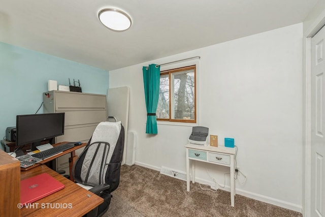 carpeted office featuring baseboards