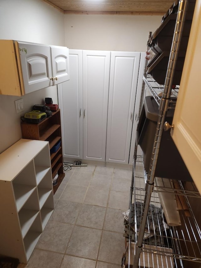 spacious closet with light tile patterned flooring