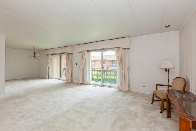 living area featuring an inviting chandelier and light colored carpet