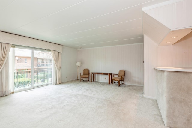 unfurnished room with carpet floors and baseboards