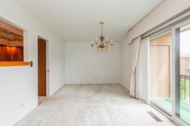 unfurnished dining area with light colored carpet, visible vents, and an inviting chandelier