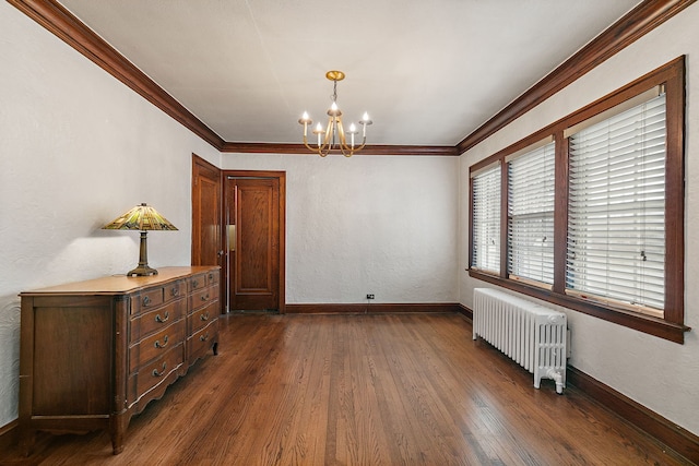 dining space with a chandelier, dark wood-style flooring, baseboards, radiator, and crown molding