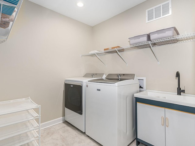 laundry room with recessed lighting, a sink, visible vents, baseboards, and washer and dryer