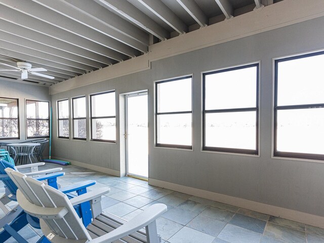 sunroom / solarium with ceiling fan