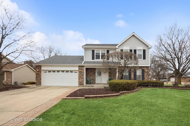 traditional-style house featuring an attached garage, a front lawn, concrete driveway, and brick siding