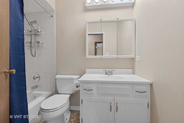 bathroom featuring baseboards, vanity, toilet, and bathing tub / shower combination