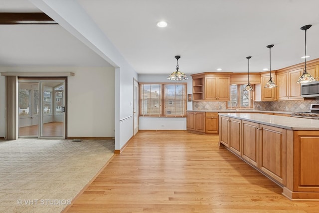 kitchen with stainless steel appliances, light countertops, light wood-type flooring, backsplash, and open shelves