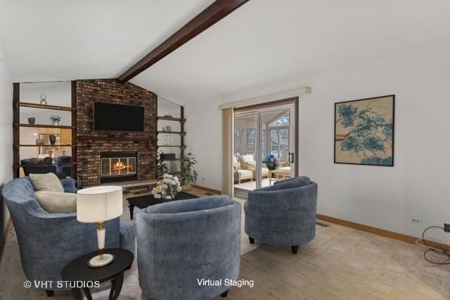 living area featuring lofted ceiling with beams, a brick fireplace, and baseboards